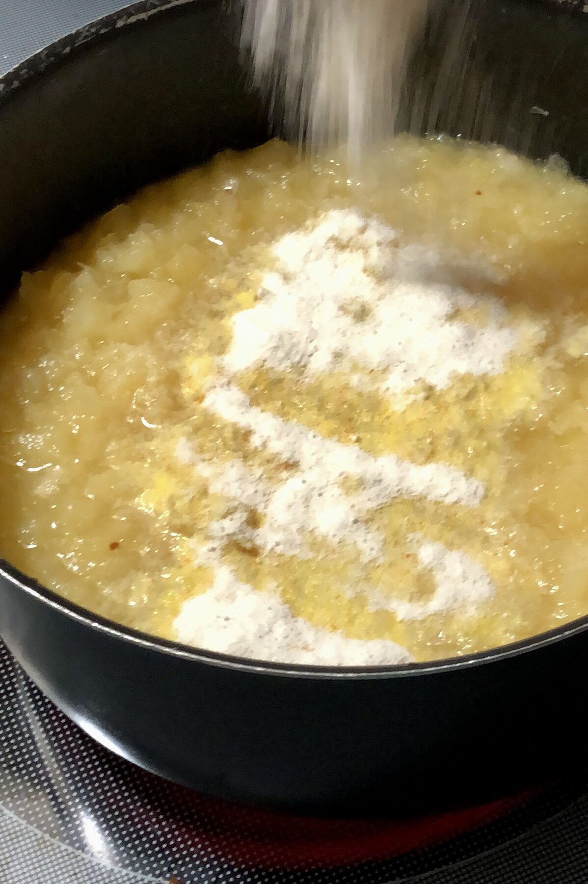 Starting the cooking process with crushed pineapples and adding Jello mix