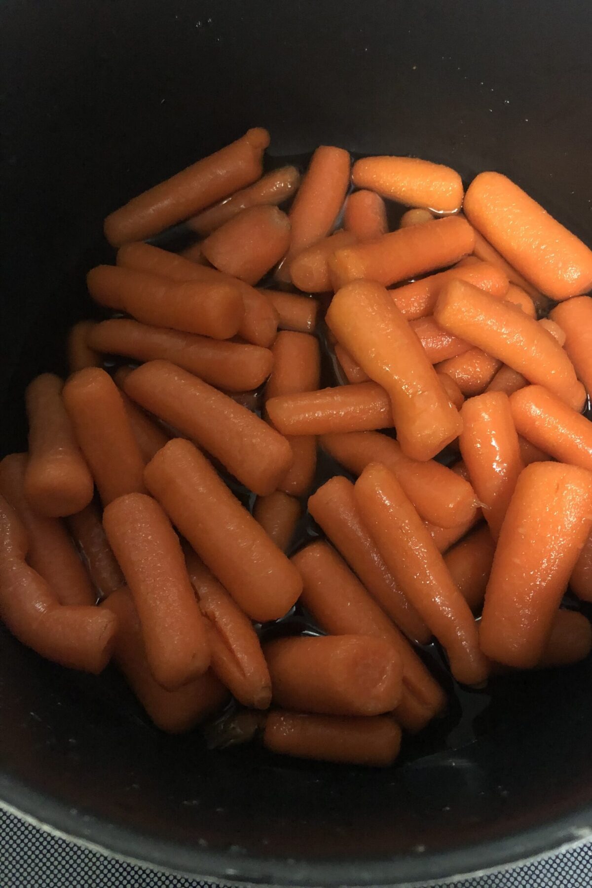 Once you have the water heated up the mix together and make sure that all carrot are covered and mix occasionally