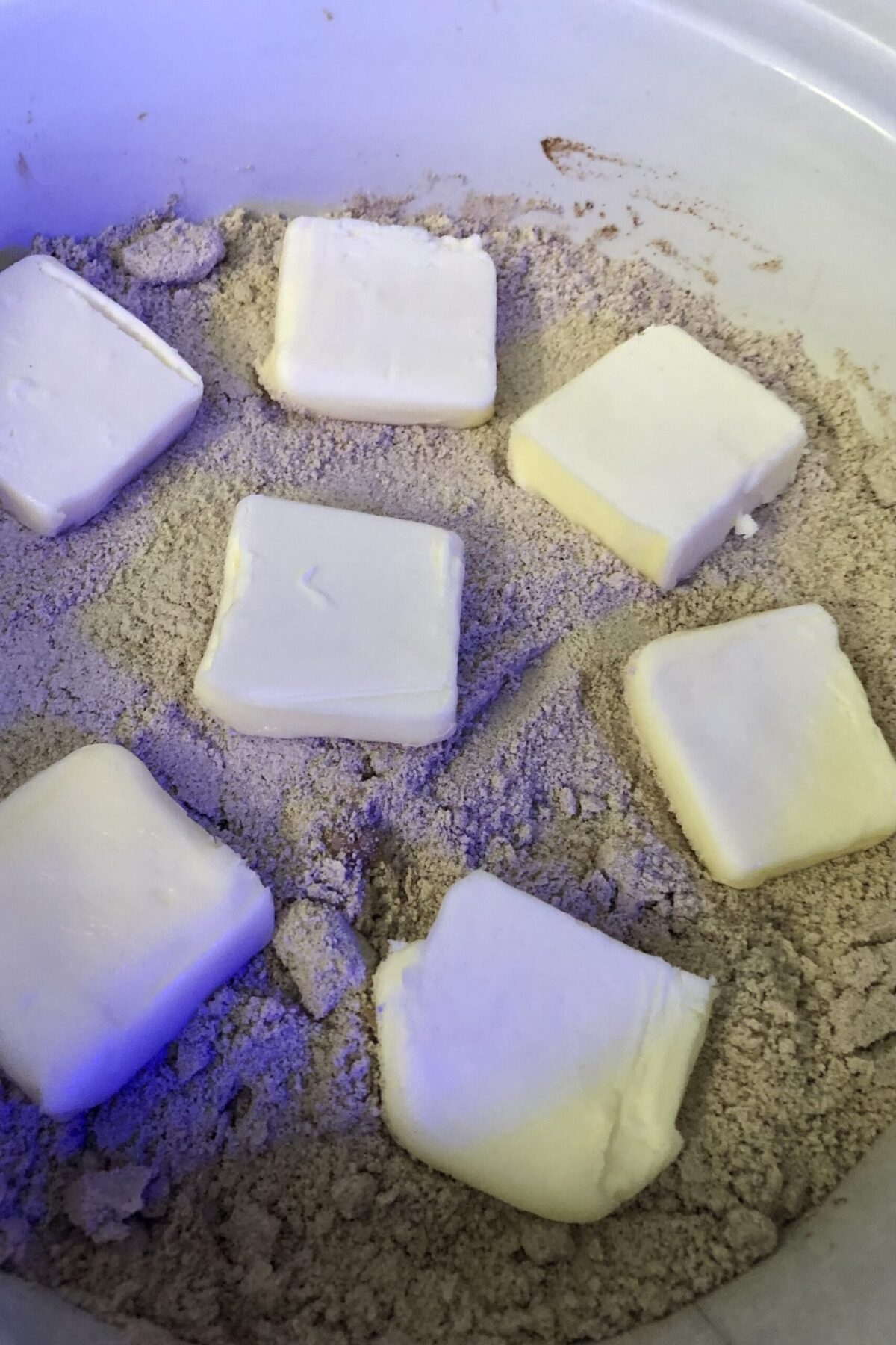 Butter has been placed on top 7 prices and is ready to have the cover put on and cooked