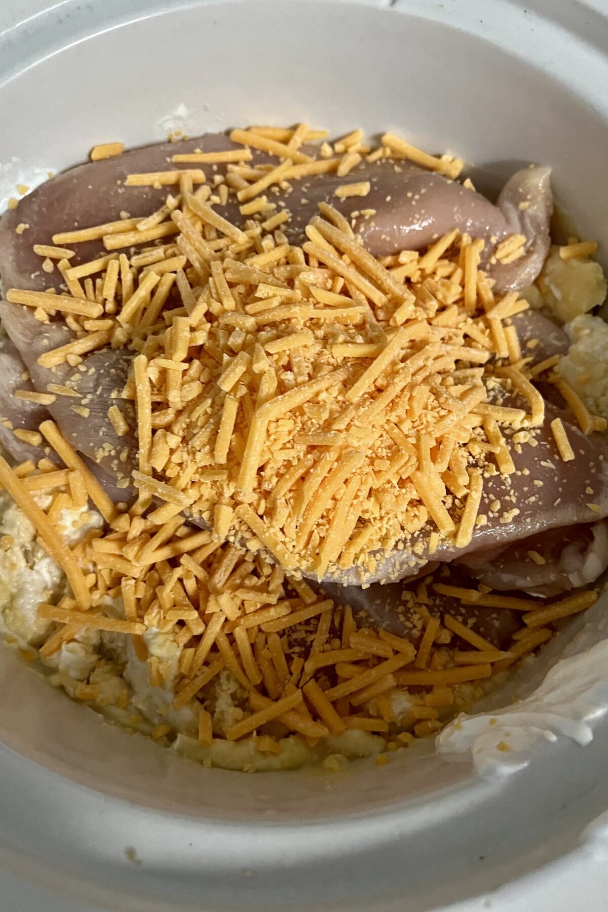 and there’s even greater contrast in this picture of the cheesy chicken as the cheese has been added on top of the chicken before it all gets mixed together