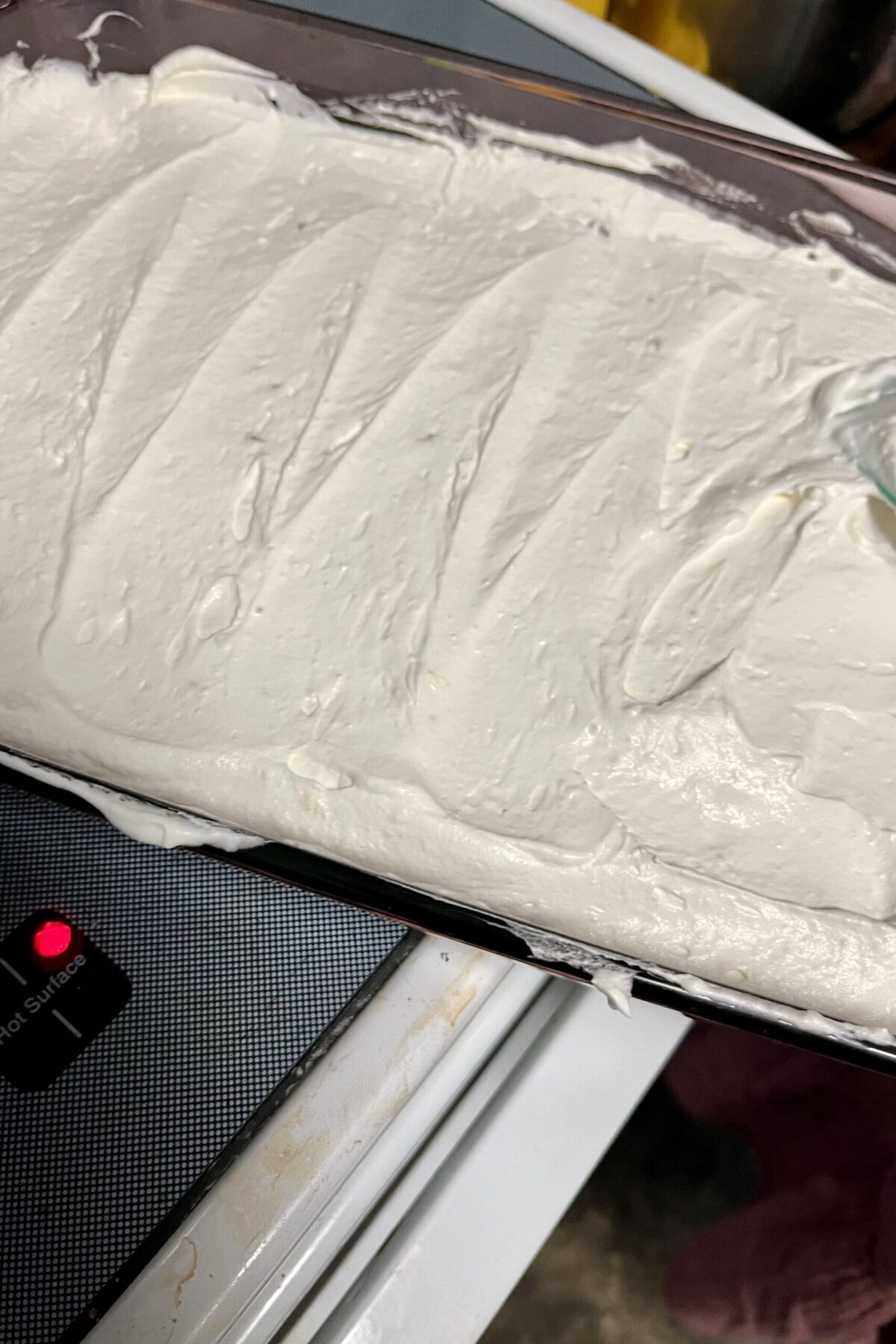 Cream cheese and whipped cream has been put on top of the pretzels to squeeze it into the side has a nice kind of wave look through it from pushing it out and trying to make it somewhat level