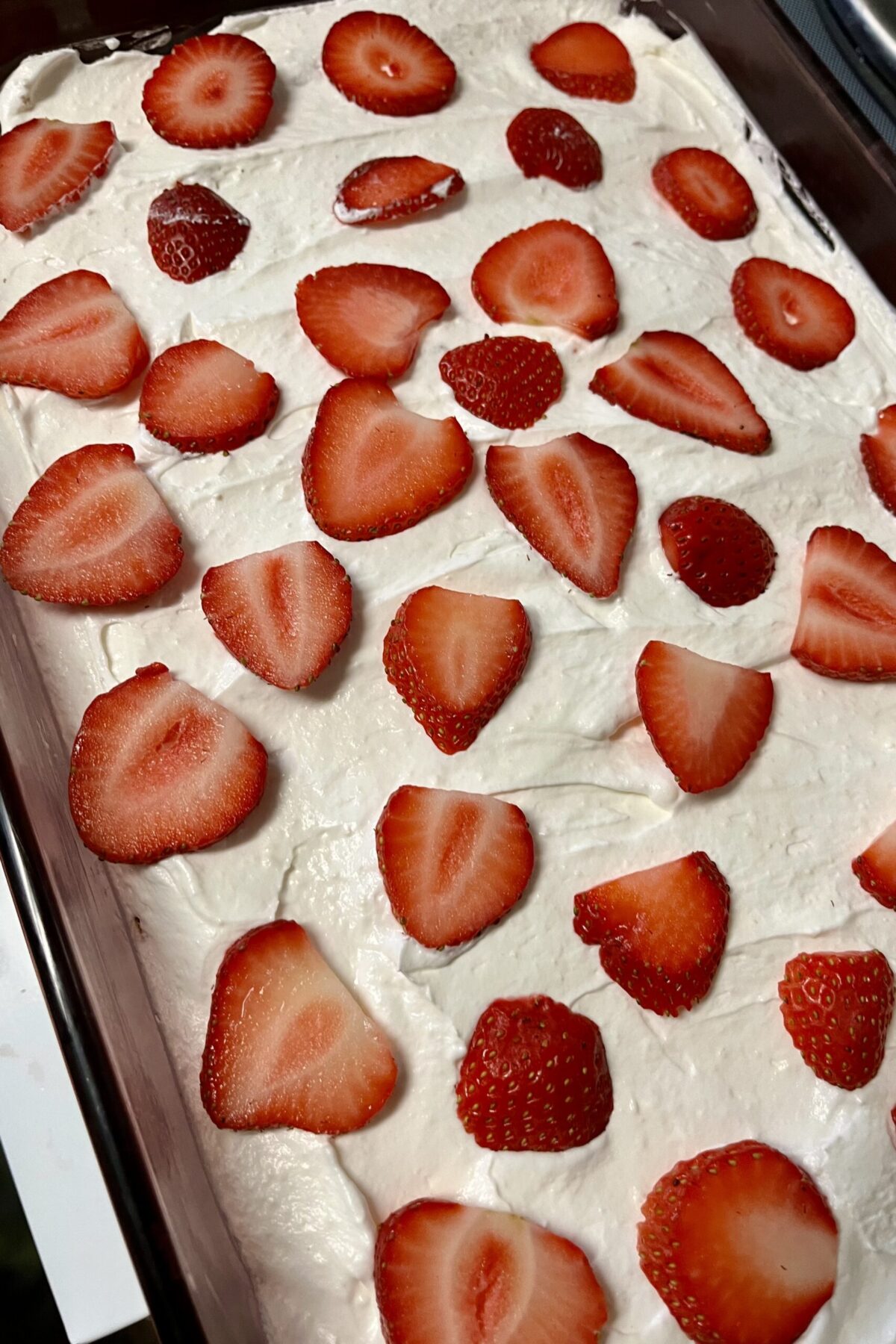 Strawberries a banana on top of the cream cheese just to make a design and make it easy to place