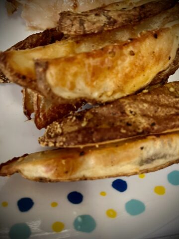 Square image Simple roast potatoes wedges I’ve been added to a play with polkadots and a nice golden brown color to them