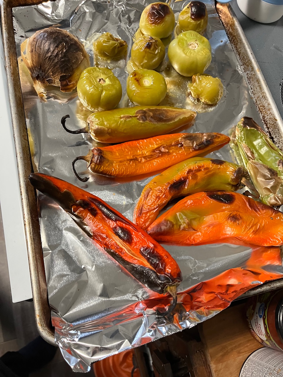 Peppers, onion, and a hen tomatillos all have been in the oven all kind of blackish color and some areas up a little bit