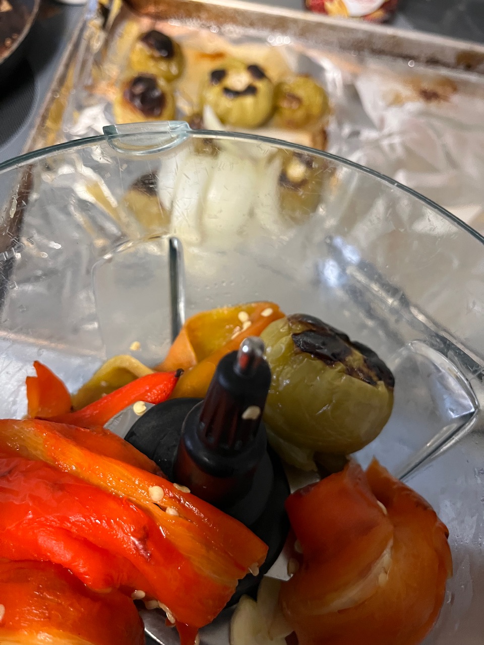 Peppers and cut up a little tomatillos have been see some in the background, along with a little bit of onion, ready to be turned into salsa Verde