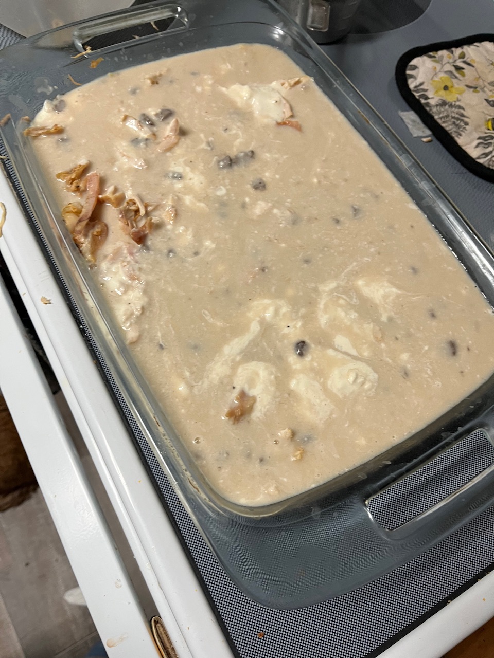 Chicken broth and cream of chicken have been added as well. You can see that the dish is filling up makes too much. An hour we’re almost ready to put the oven.