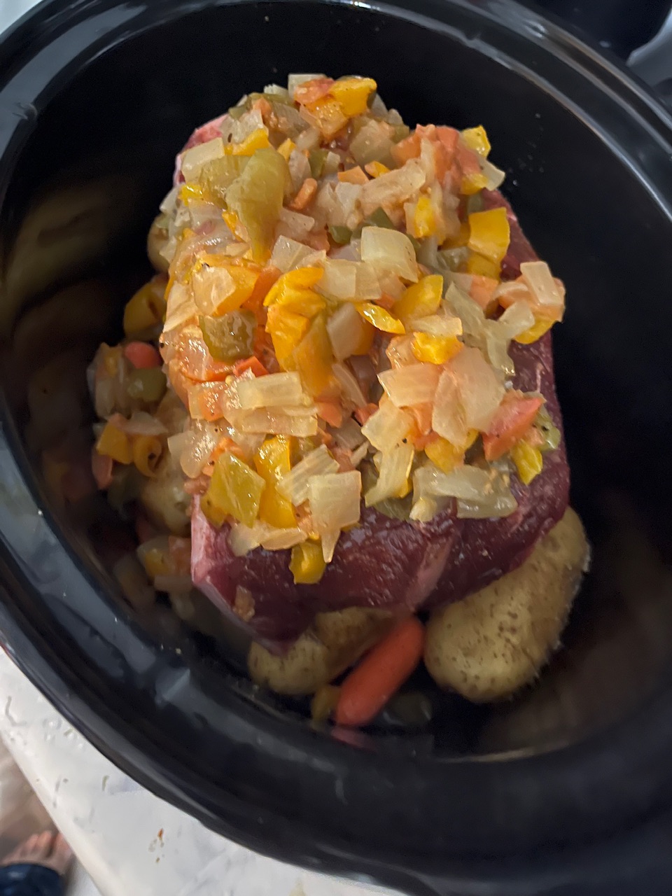 Combination of bell peppers, onions, garlic globe. I’ve all been added on top of.